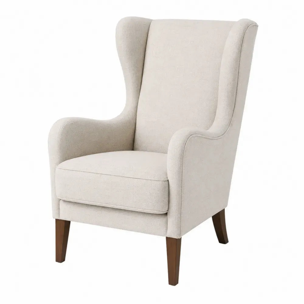 Butaca orejera tapizada en tela de poliéster beige con reposabrazos respaldo alto acolchado y patas de madera marrón 73 x 78 x 101 cm